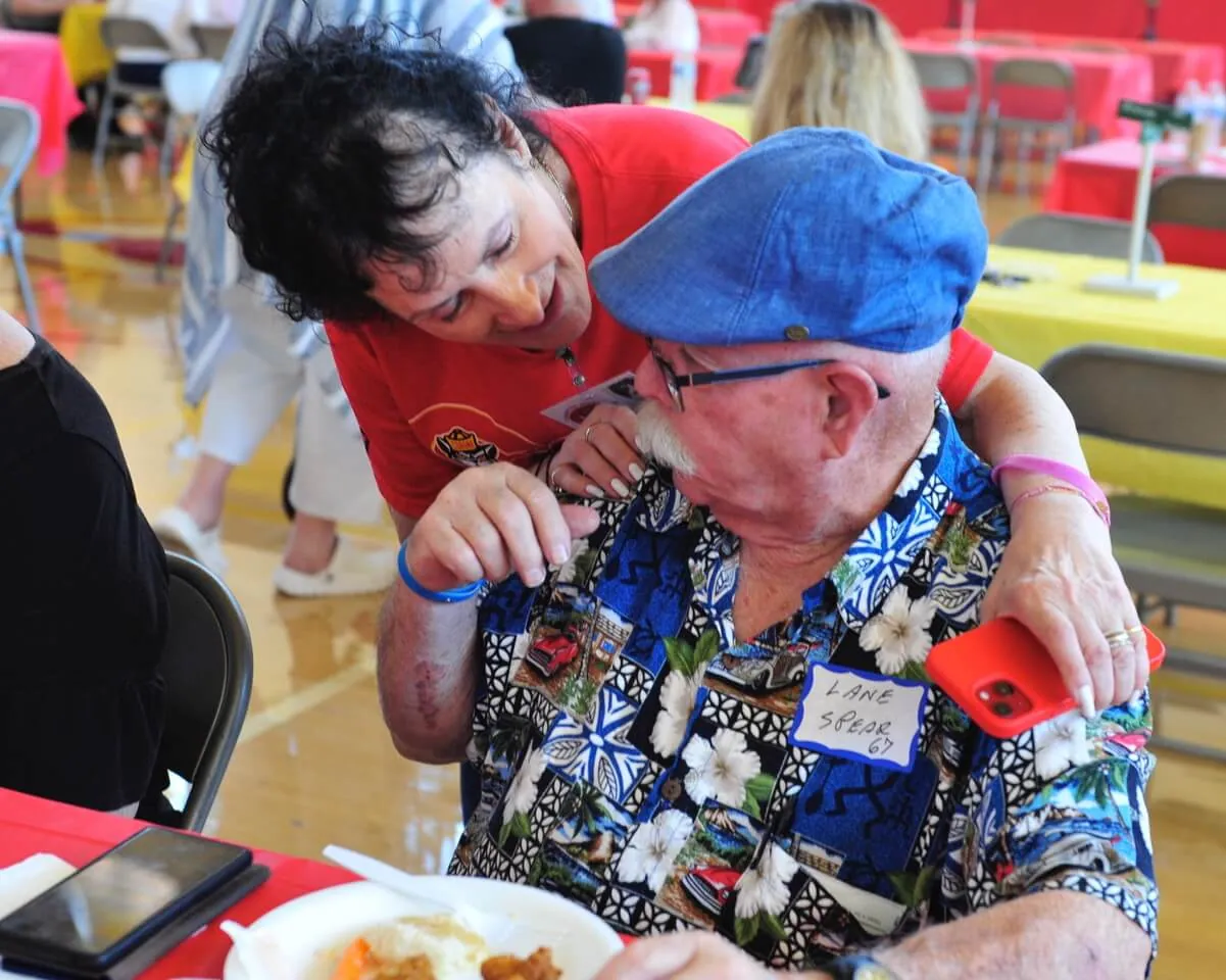 Corona Summer Class of 1967 graduates Pam Costa and Lane Spear share memories as about 500 alumni of Corona High School gathered Sunday for an all-class reunion in the auxiliary gymnasium. Corona Summer Photo by Jerry Soifer