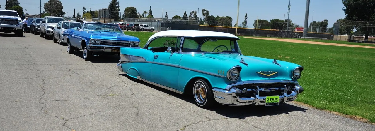 Corona Summer In a scene from the generational film “American Grafitti,” classic Chevy’s from the 50’s and 60’s grace the parking lot at Corona High for its reunion.