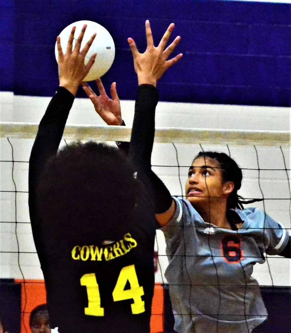 Eastvale Roosevelt’s Ryah Brock (6) dinks the ball over Cajon’s Esmeralda Hernandez (14) during the Victory.