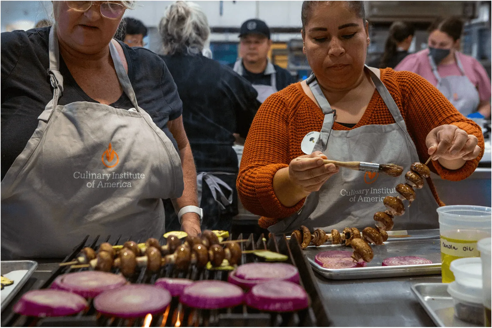 As part of Farm to School, an initiative to provide healthier lunches in California schools, School food service workers at San Luis Coastal Unified School District, Teresa Vigil, left, and Maria Martínez, right, train at the Culinary Institute of America in Napa on Aug. 3, 2023.
Credit: Photo by Semantha Norris, CalMatters