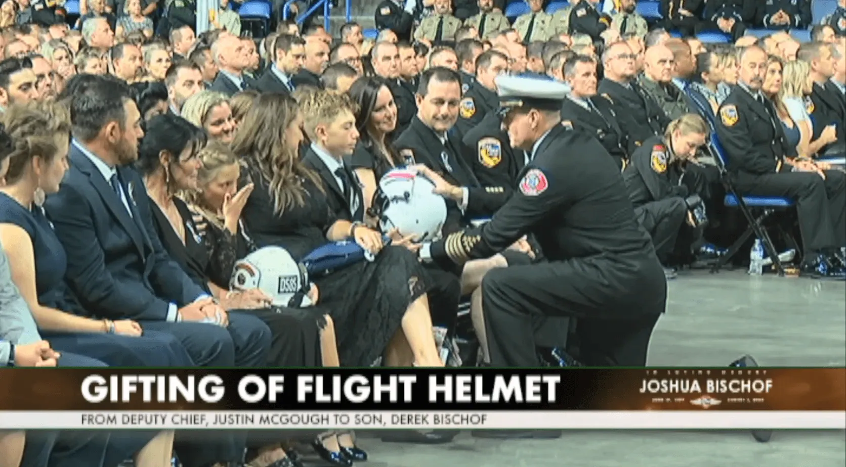 Bischof is presented with his dad's flight helmet, by Cal Fire Deputy Chief Justin McGough
Credit: Cal Fire