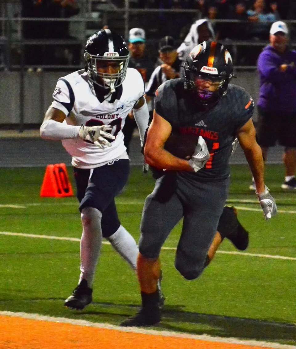 Ontario Colony’s Curtis Truly (20/left) can’t catch Eastvale Roosevelt’s Mitchell Rodenbaugh (34/right) who scored the game winning touchdown with seconds left. The Mustangs defeated the Titans 38 – 31.
Credit: Photo by Gary Evans
