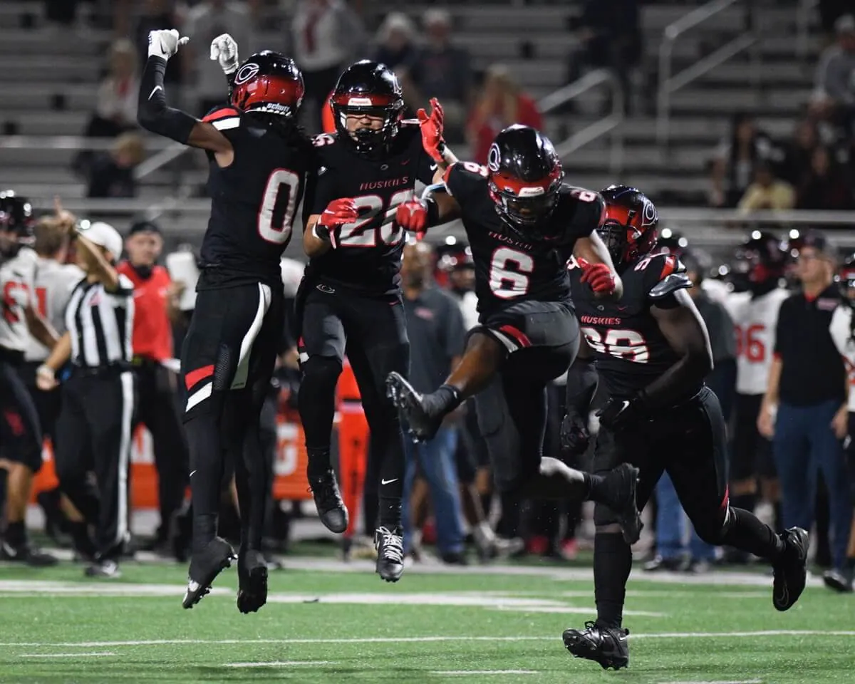 Corona Centennial's LaRue Zamarano II, Kyle Winston, Syncere Brackett and Parker LaRocco celebrate their team's come-from-behind, 42-35 win over visiting Liberty of Peoria, Arizona. It was the visitors first loss and both teams are ranked in the top 25 nationally by MaxPreps.
Credit: Photo by Jerry Soifer