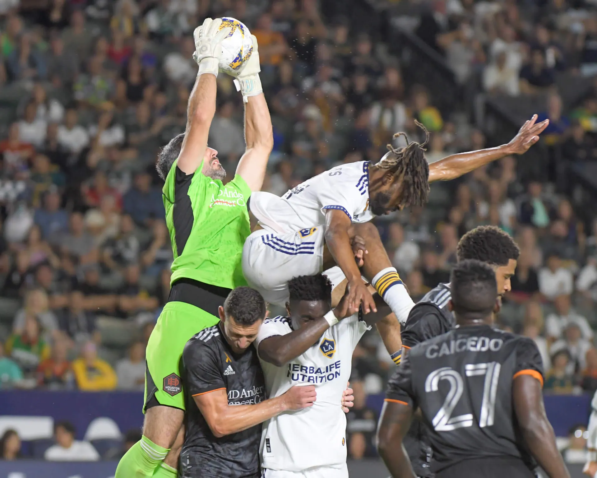 Houston Dynamos goalie Andrew Tarbell makes a leaping save against the Los Angeles Galaxy in a scoreless tie in an MLS game Saturday at the Dignity Health Sports Park in Carson.
Credit: Photo by Jerry Soifer