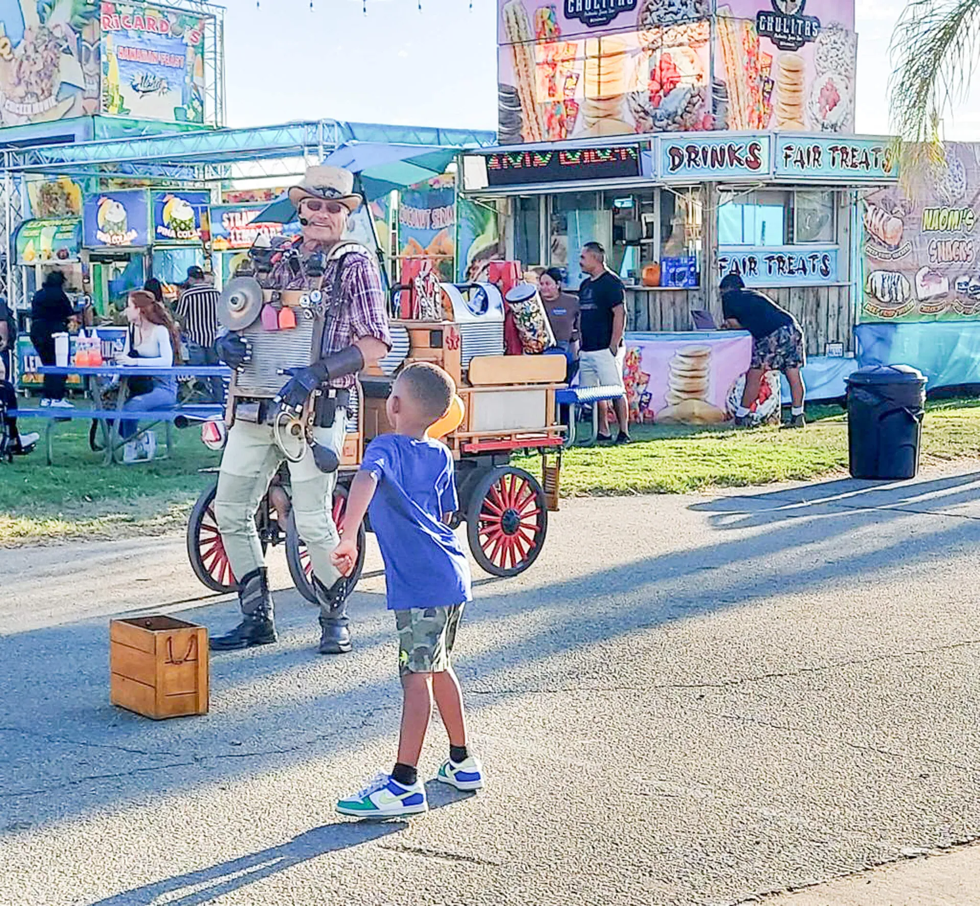 Southern California Fair. “Washboard Willy’s” one-man percussion band sends out a rhythm that captivates joyful passersby. Credit: Photo by Linda Thompson