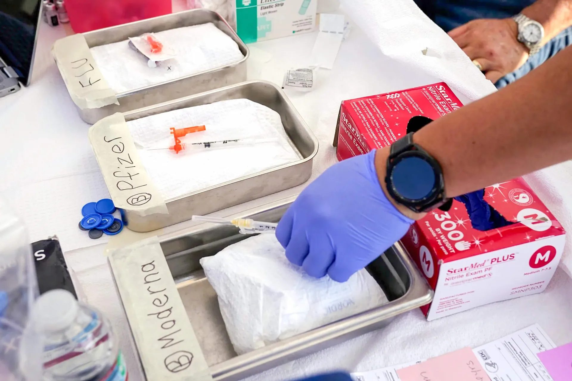 Tripledemic. Syringes with vaccines at the L.A. Care and Blue Shield of California Promise Health Plans' Community Resource Center where they were offering flu and COVID-19 vaccines on Oct. 28, 2022. Credit: Photo by Mark J. Terrill, AP Photo