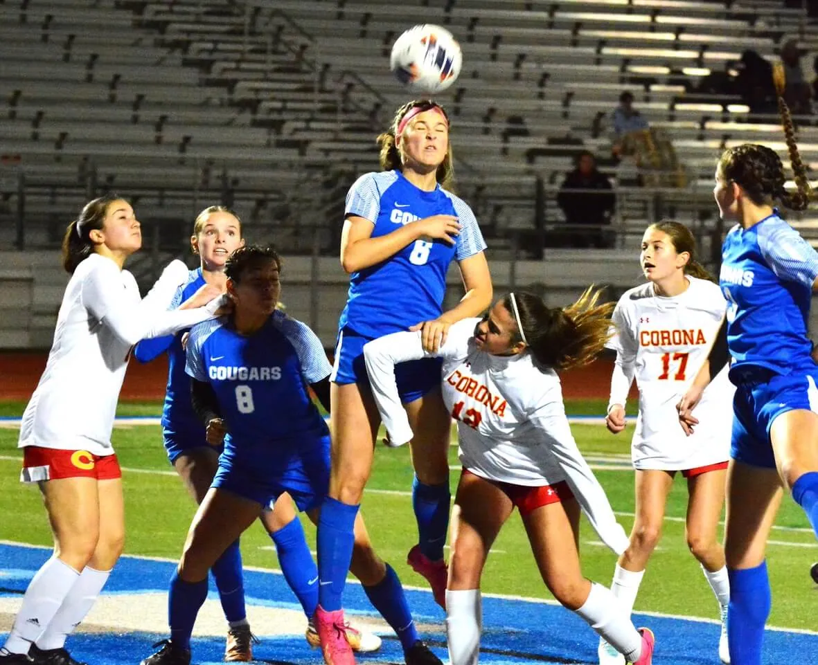 Norco’s Ashlee Abellana (6) heads the ball off a corner kick while left to right Corona’s Delaney Prado (14), Norco’s Jaylin Young (5), Karen Pedraza (8), Corona’s Aua Cruz (12), Leah Walker (17), and Norco’s Emmalee Snow (3) watch. The Cougars defeated the Panthers 2 – 0.
Credit: Photo by Gary Evans