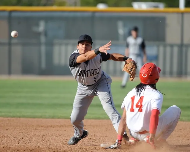 Corona Santiago shortstop Chris Ramirez completes a double play throw to first base, over Corona's sliding Anthony Murphy.