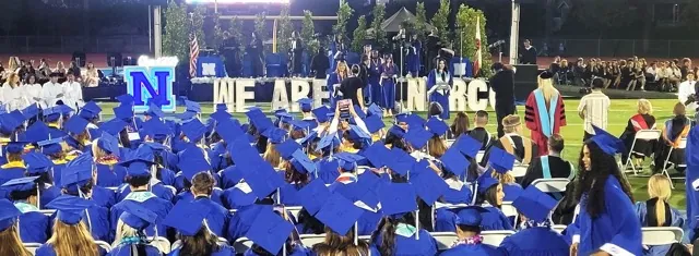 Norco High Class of 2024 graduates watch fellow students receive their diplomas during the commencement ceremony last week at the school.
