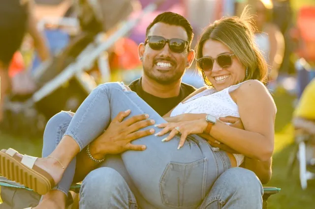 Ontario residents Jordi and Jillian Ubaldo enjoy the music of the band "Bruno and the Hooligans" Friday at the Picnic in the Park in Eastvale.
Credit: Photo by Jerry Soifer