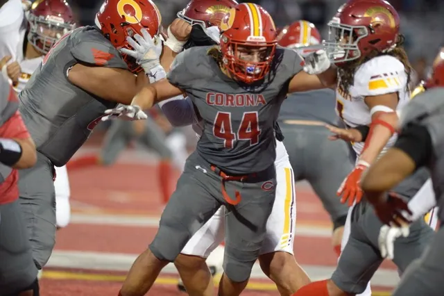 Corona's Jonathan Edgerton looks to make a block against Riverside Hillcrest Friday.
Credit: Photo by Jerry Soifer
