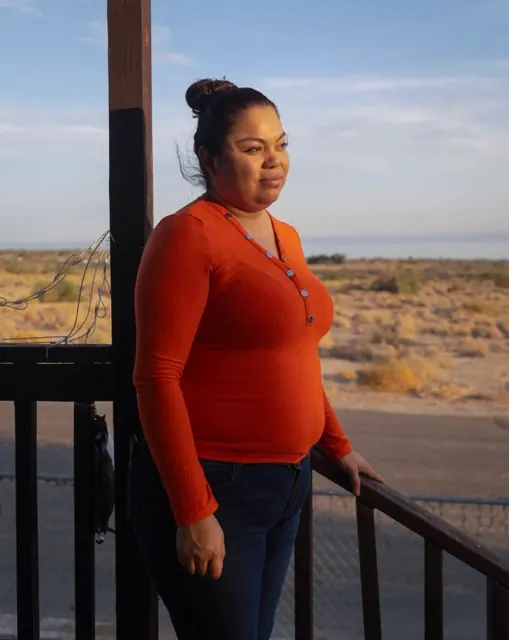 Danger in the Dust: Coachella Valley Residents Struggle to Breathe. Sara Renteria, who suffers from asthma, stands on the porch of her home in North Shore, on July 17, 2024. Credit: Photo by Zoë Meyers for CalMatters