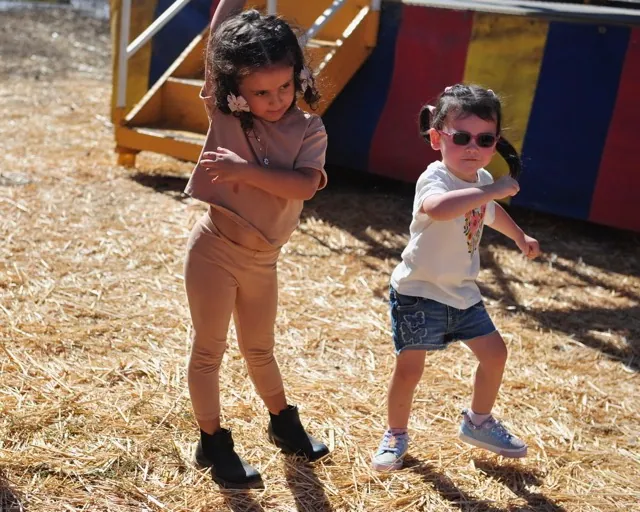 Amira, 4, and her sister Mila, 3, Abdulla, of Riverside, dance at a Halloween pumpkin patch on El Sobrante Road in Corona.
Credit: Photo by Jerry Soifer