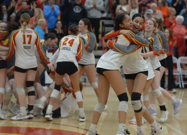 Corona’s Samantha Peay and Linniah Ballou hug as they celebrate the Panthers' championship win. Photo by Jerry Soifer