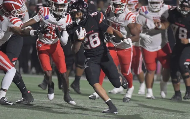 Corona Centennial running back Dean Gibson breaks loose against Santa Ana Mater Dei.