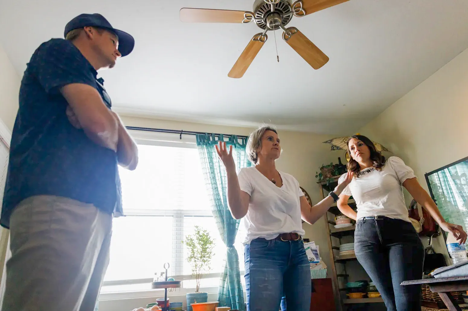 Affordable Housing in the Inland Empire. From left, housing advocates of Upward Community Aaron Cook, Laurel Lamont and Melissa Bourbonnais speak inside Lamont’s apartment in Temecula on Oct. 11, 2024.
Credit: Photo by Kristian Carreon for CalMatters