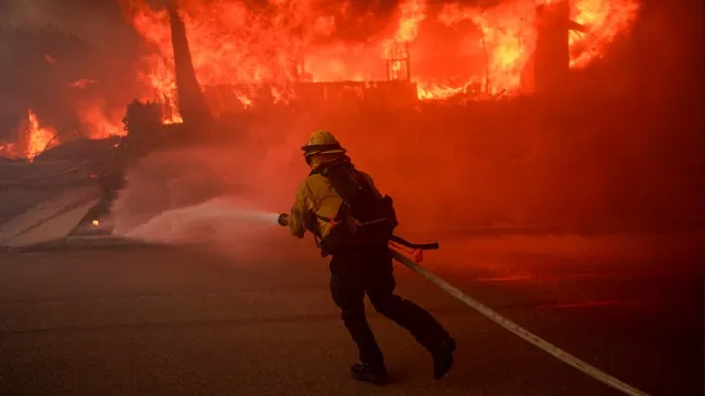 January Fires. A firefighter battles flames from the Palisades Fire in the Pacific Palisades neighborhood of Los Angeles on Jan. 7, 2025. Credit: Photo by Eric Thayer, Getty Images