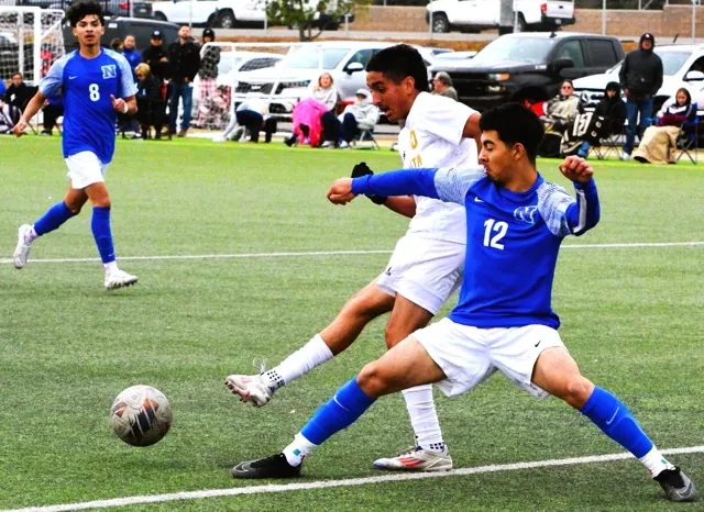 Norco’s Jeovani Mercado (12) battles Monte Vista’s Miguel Gomez (left) for the ball during the Cougars 1 – 1 tie with the Monarchs. Norco’s Jesse Garcia (8) watches the play.
Credit: Photo by Gary Evans