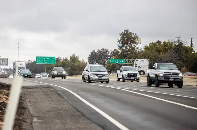 lemon law. Traffic traveling down Highway 99 near Parkway Drive in Fresno on Feb. 25, 2023. Credit: Photo by Larry Valenzuela, CalMatters/CatchLight Local
