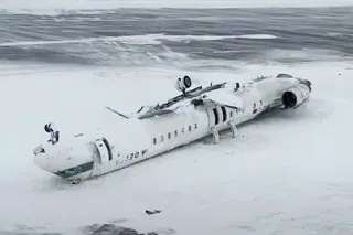 Plane That Flipped Over. Photo: Delta Crash Caption: This image taken from video released by the Transportation Safety Board of Canada on Wednesday, Feb. 19, 2025, shows the crashed plane of Delta flight 4819 at Toronto Pearson International Airport, in Mississauga, Ontario, on Tuesday, Feb. 18.  Credit: Transportation Safety Board of Canada via AP