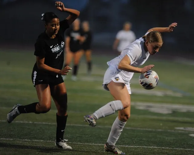 Santiago and Palos Verdes soccer players’ tangle in CIF Open division match won by Palos Verdes 1-0.
Credit: Photo by Jerry Soifer