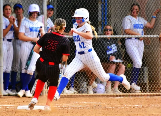 Norco’s Dakota Potter (42) stretches for first base while Los Alamitos’s Morgan Fitzpatrick (25) is a step late for the out.
Credit: Photo by Gary Evans