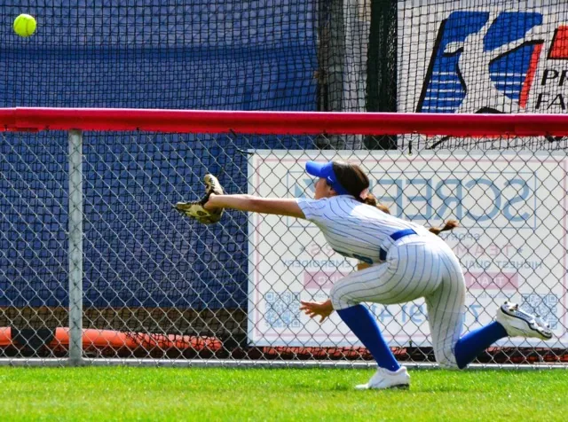 Norco left fielder Kendra Nelsen makes a diving catch during the Cougars 6 – 5 victory over Los Alamitos. Credit: Photo by Gary Evans