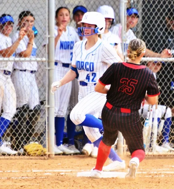 Norco’s Dakota Potter (42) looks towards the umpire for the safe call while Los Alamitos’s Morgan Fitzpatrick (25) was a step late to get Potter out at first. The Cougars defeated the Griffins 6 – 5.
Credit: Photo by Gary Evans