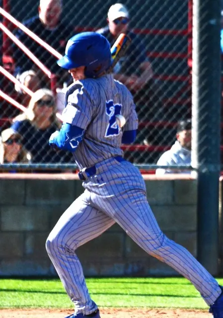 Norco’s Ryan Farias (24) gets drilled between the numbers during his first at bat in the second game against Corona. Photo by Gary Evans