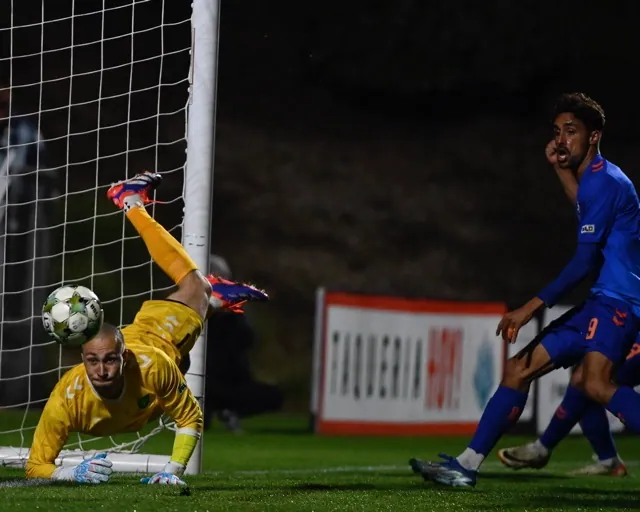 Corona Santiago High grad Ethan Zubak nears the goal mouth Saturday at Lexington SC goalie Logan Ketterer blocks a shot in the match played at Great Park in Irvine. The teams tied, 2-all.
Photo by Jerry Soifer