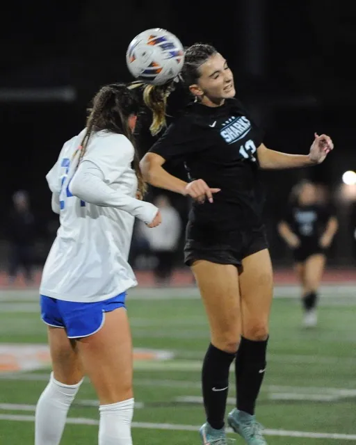 Corona Santiago’s Hailey Hild, right, heads the ball against Santa Margarita in the CIF open division sectional championship game won by the Eagles, 4-2. Seeded 2nd in the regionals, the Sharks topped Mater Dei 1-0 on Tuesday, advancing to the semi-finals vs. Westlake Village Oaks Christian, on Thursday night in a game played after the Sentinel went to print.
Credit: Photo by Jerry Soifer