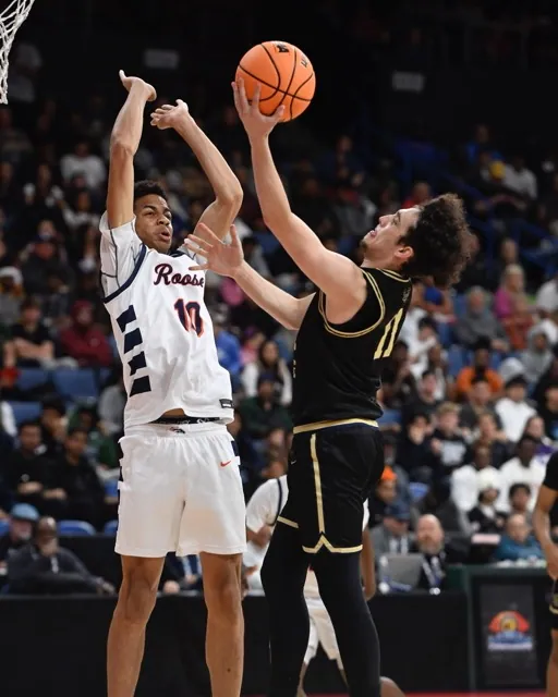 Roosevelt's Christian Benjamin defends against Notre Dame's Micah Tannenbaum.
Credit: Photo by Jerry Soifer