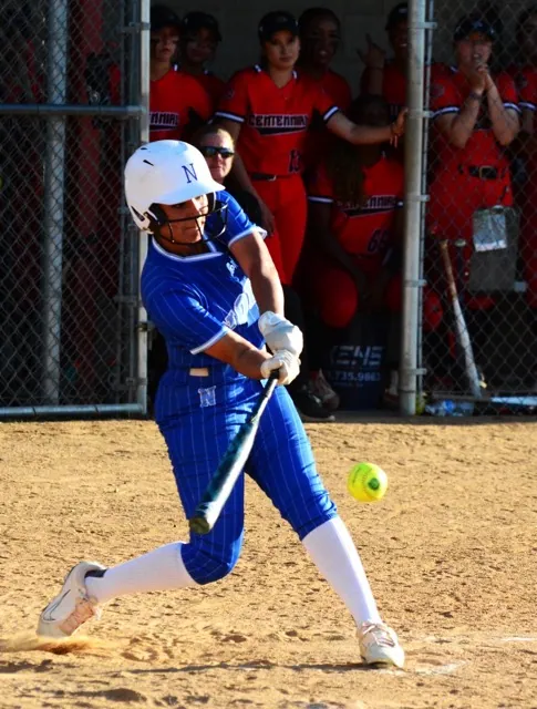Norco’s Angelina Gonzales raps a single during the Cougars 4 – 2 victory over Centennial. 
Credit: Photo by Gary Evans
