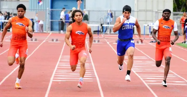 (L-R) Roosevelt’s Chuck Uzoma, Levi Yancy, Norco’s Dillon Dawud, and Roosevelt’s Isaiah Charles compete in the boys 200 varsity dash. Dawud prevailed, setting a personal record.
Credit: Photo by Gary Evans