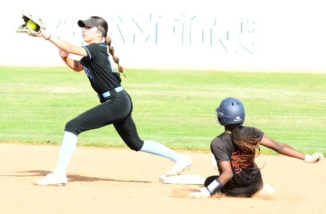 Norco’s Leighton Gray catches the throw from pitcher Camryn May for the force at second of Roosevelt’s Taniyah Washington (55) during the Cougars 3 – 0 victory over the Mustangs.
Credit: Photo by Gary Evans