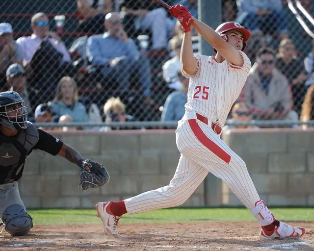 Featured Photos 4-18-2025 . Corona third baseman Brady Ebel, eyes the shot off his bat that proves to be the game-winning homer defeating visiting Santiago 4-3 in the Big VIII League game on Monday. Credit: Photo by Jerry Soifer