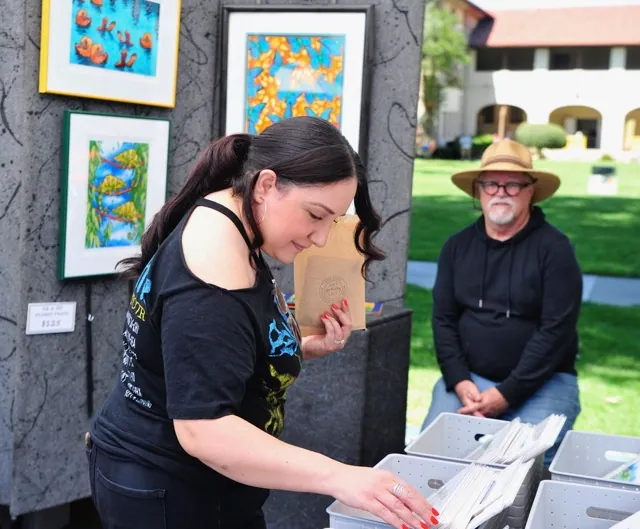 Diane Bravo, of Corona, peruses the work of artist Pat Cranor, of La Verne, at the Corona Arts and Music Festival at the Historic Civic Center Saturday.
Credit: Photo by Jerry Soifer