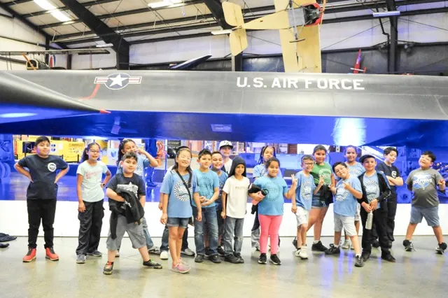 Students from Mead Valley Elementary School in front of the U.S. Air Force SR-71 spy plane at the March Air Museum before the start of the Southern California Air Show.