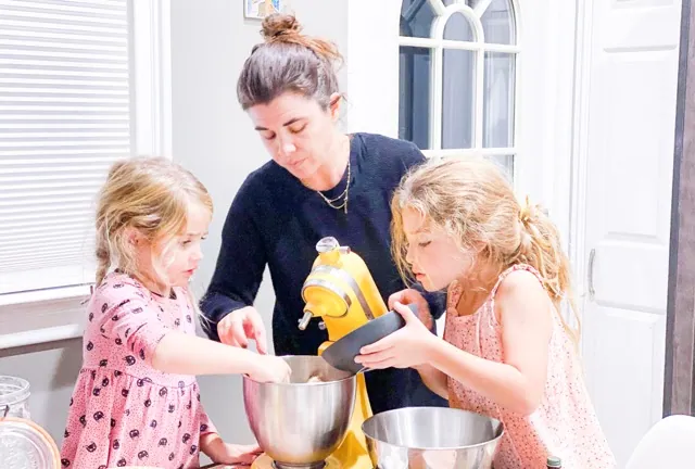 Cooking With Kids. Danielle McWilliams cooks with her daughters Reese, 7, right, and Remi, 4, at their New Jersey home on Oct. 27, 2021. Credit:Danielle McWilliams via AP