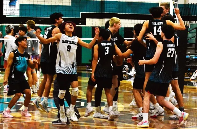 Santiago’s Elijah Tajo (9) exalts after the Sharks rebounded after losing the first two sets to sweep the next three to defeat the Westlake Warriors in the CIF quarter-final playoffs.  Santiago was swept in the semi-finals by Santa Barbara.  Celebrating in the background include Caleb Guieb (3), Spencer Tran (14) and Brady Allen (27). 
Credit: Photo by Gary Evans
