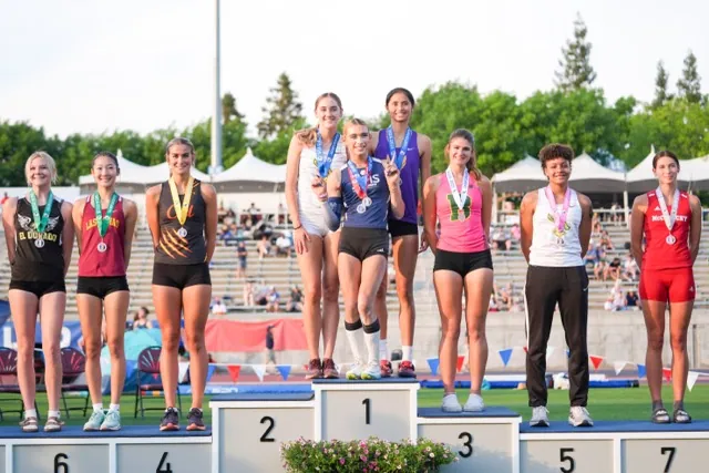 CIF State Meet. AB Hernandez, center, flashes a sign as she shares the first-place spot on the podium with Jillene Wetteland, left, and Lelani Laruelle during a medal ceremony for the high jump at the California high school track-and-field championships in Clovis, Calif., Saturday, May 31, 2025.  Credit: AP Photo/Jae C. Hong