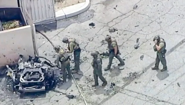 FBI arrests suspect. Law enforcement investigate a vehicle after an explosion on Saturday, May 17, 2025 in Palm Springs, Calif.  (ABC7 Los Angeles via AP)