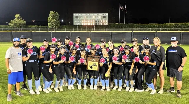 The Norco High School Girls softball team defeated the El Modena Vanguards 3 – 0 to claim the 2025 CIF Division 1 softball Championship. Left to right: Assistant Coaches Manny Herrera, Dave Mishriki, players Camryn May, Savannah Gonzalez, Sadie Burroughs, Sophie Montoya, Peyton May, Leighton Gray, Angelina Gonzales, Kimmy Neal, Isabella ray, Ashley Duran, Sasha Pham holding the CIF Plaque, Dillyn Eckenrod, Coral Williams, Madison Costanzo, Ashyln Braun, Ray Logue, Dakota Potter, London Potter, Head Coach Rick Robinson, Kendra Nelson, Assistant Coaches Beth Robinson-Windham, and Dave Angene.