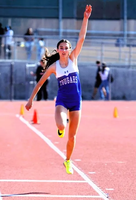 Norco’s Kaylee Best flies through the air for a 19 feet .75 inch long jump at the CIF Masters Meet at Moorpark.