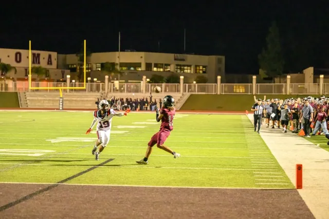 Featured Photo's 9-19-2025. Paloma Valley’s WR, Noah Davis (13) is wide open at the 6 yard line for an easy touchdown right before halftime, with Heritage’s Jaylen Shannon (19) trying to close the gap.