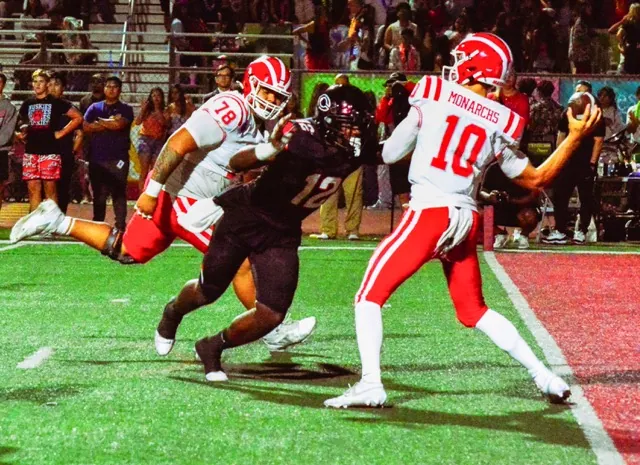 Corona Centennial’s Jonathan McKinley II (12) is about to hit Mater Dei QB Ryan Hopkins (10) as he attempts to pass. The pass fluttered into the hands of defensive back Jaden Walk-Green, who raced 10 yards for the pick 6, giving the Huskies and early 14 – 0 lead.