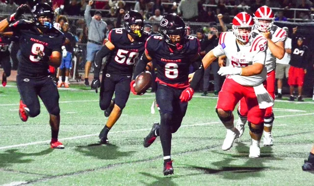 Corona Centennial’s defensive back Jaden Walk-Green intercepted this pass from Mater Dei QB Ryan Hopkins after he was hit by Jonathan McKinley II. Walk-Green ran 10 yards for the pick 6.