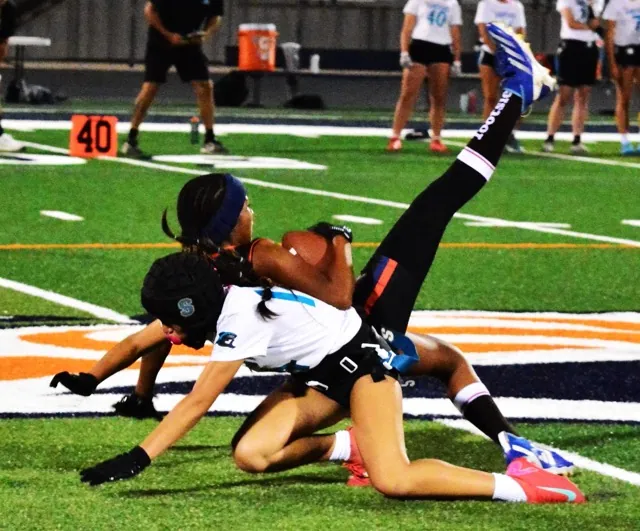Eastvale Roosevelt’s Peyton Wade (top) makes an incredible leaping snag of a pass while Santiago’s Sophea Hernandez (bottom) tries to defend. The Sharks defeated the Mustangs 24 – 12.