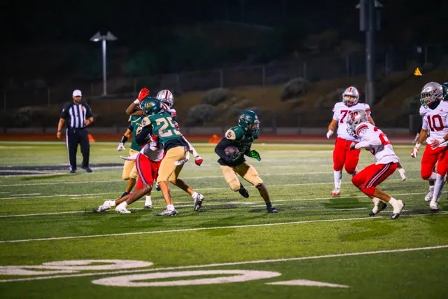 Tahquitz RB Terrell Strong (1) stares down a defender as he finds a hole