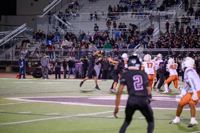Wildcat QB Isaac Navarro (7) airs out a deep bomb down the field …